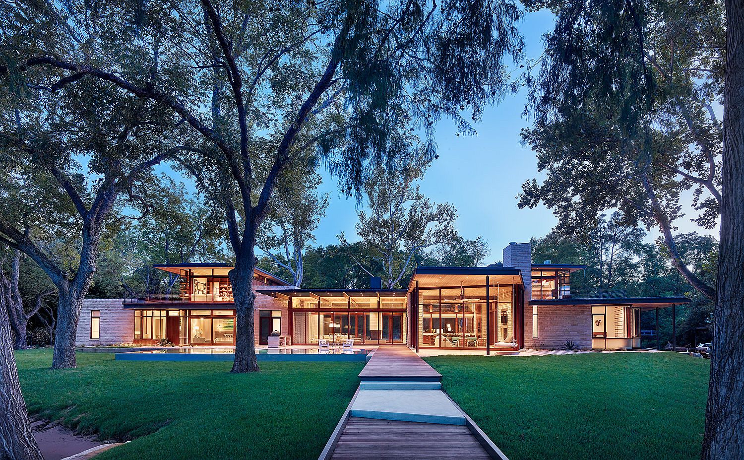 Light Floating Roofs Blend with Heavy Limestone Walls at this Vibrant  Austin Home