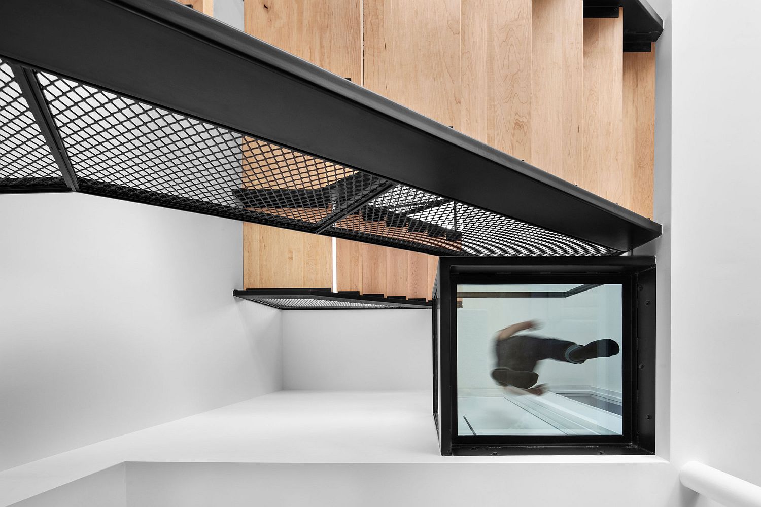 Fabulous modern stairway is the heart of the new multi-level home in Montreal