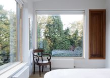 Large-glass-windows-usher-ample-light-into-the-modern-white-bedroom-217x155