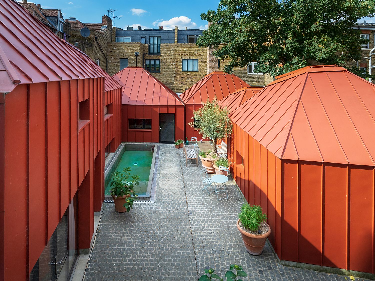 Lovely-orange-standing-seam-metal-cladding-for-the-private-home-in-London
