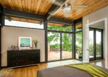 Metallic-beams-and-wood-create-a-cozy-bedroom-with-many-windows-and-glass-walls-217x155