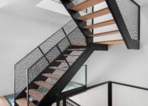 Metallic-mesh-and-wood-create-a-gorgeous-central-staircase-in-the-house-217x155