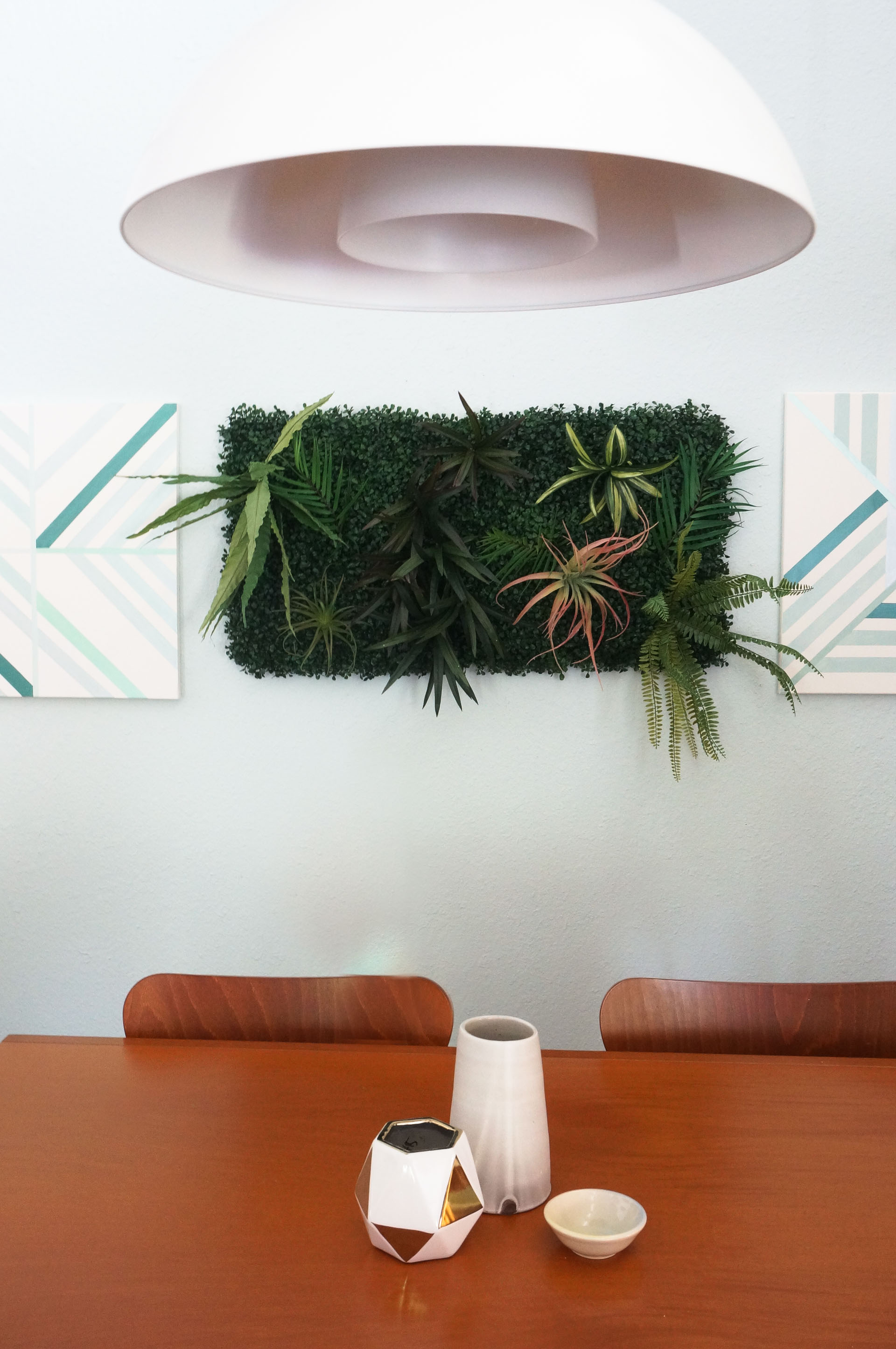 Modern dining room with a faux living wall