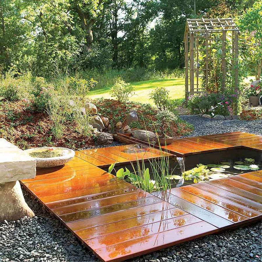 More fancier version of the simple and small backyard pond with wooden deck around it