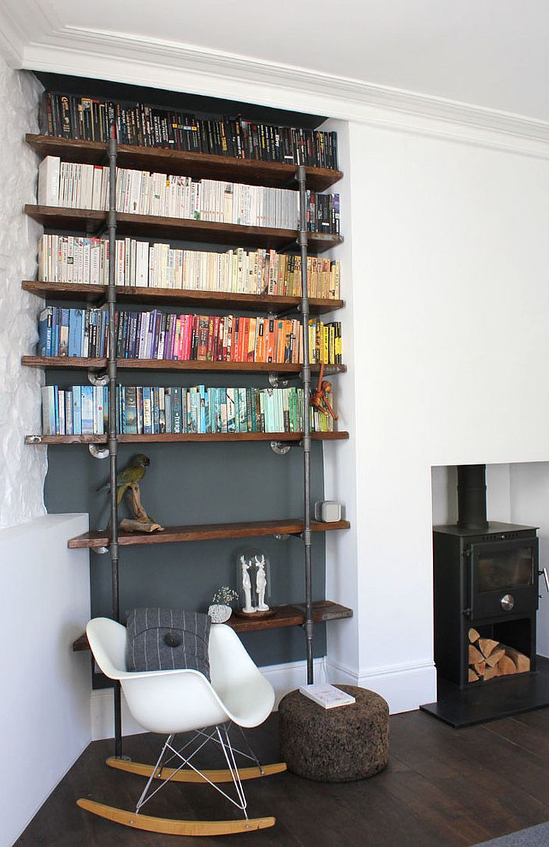 Reclaimed wood and metal pipes create a beautiful shelf in the living room