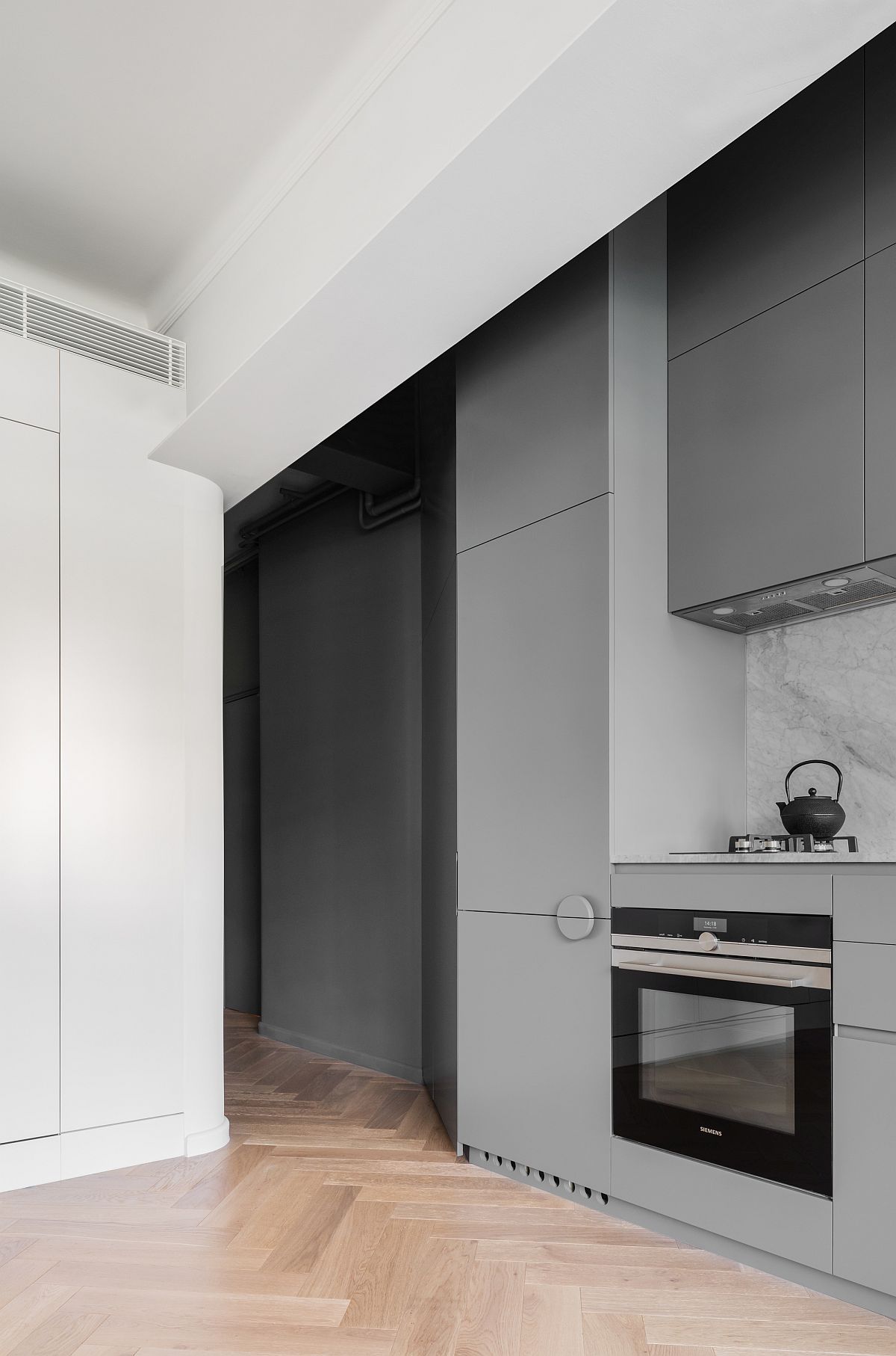 Single-wall-kitchen-in-gray-saves-space-while-adding-style-to-the-interior