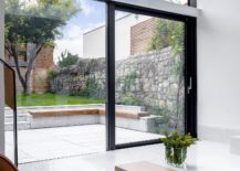 Sliding-glass-doors-connect-the-interior-with-the-backyard-217x155