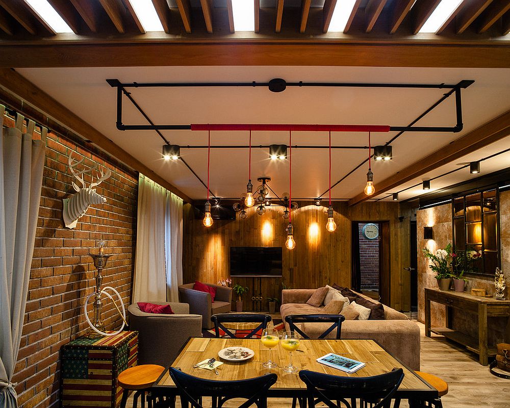 Small-industrial-living-room-with-Edison-bulbs-and-a-touch-of-red