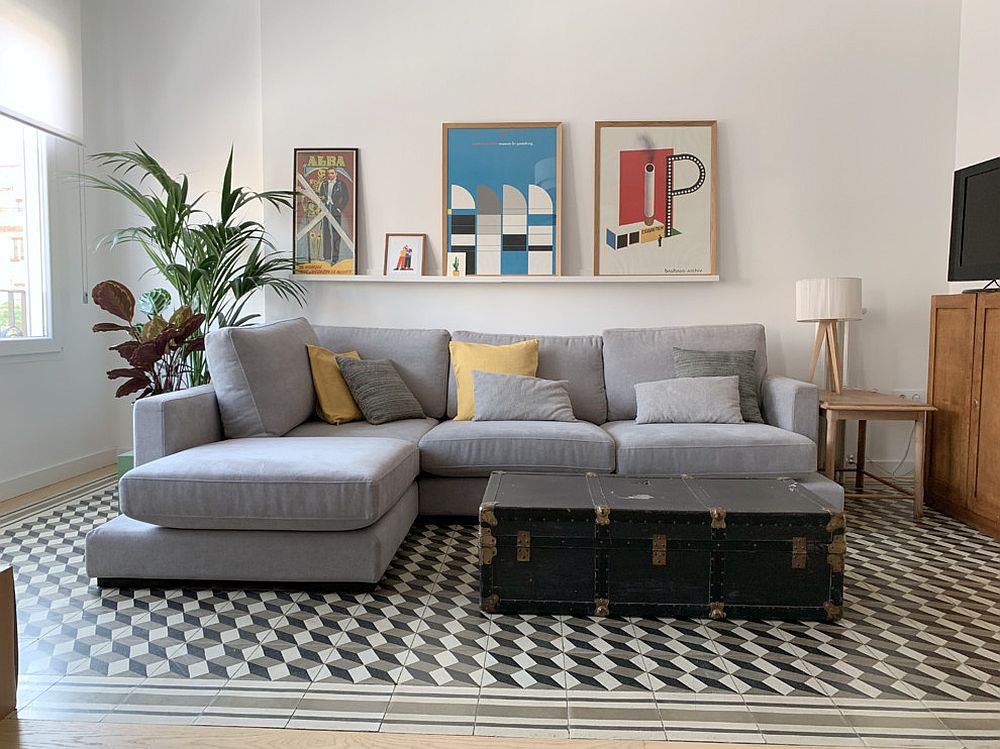 Small-living-room-with-custom-coffee-table-and-a-sectional-in-gray
