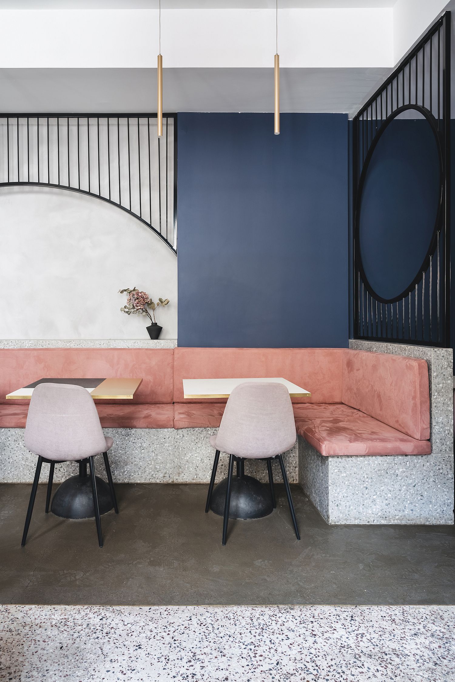 Soft-pastel-pinks-and-blues-are-coupled-with-exposed-concrete-inside-the-apartment
