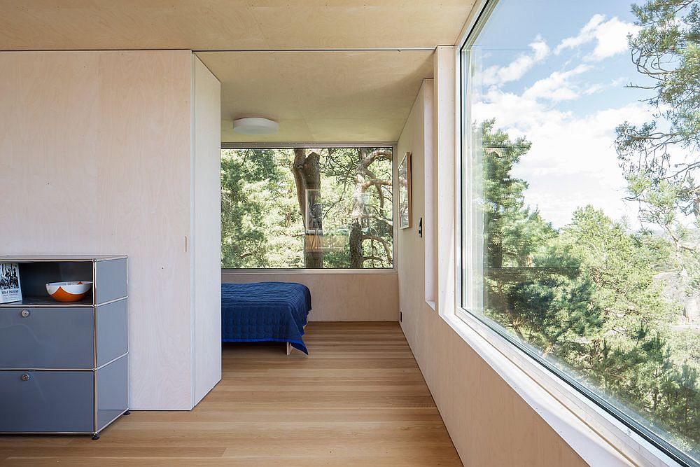 Spacious and light-filled bedroom of the cottage with brilliant views of the islets