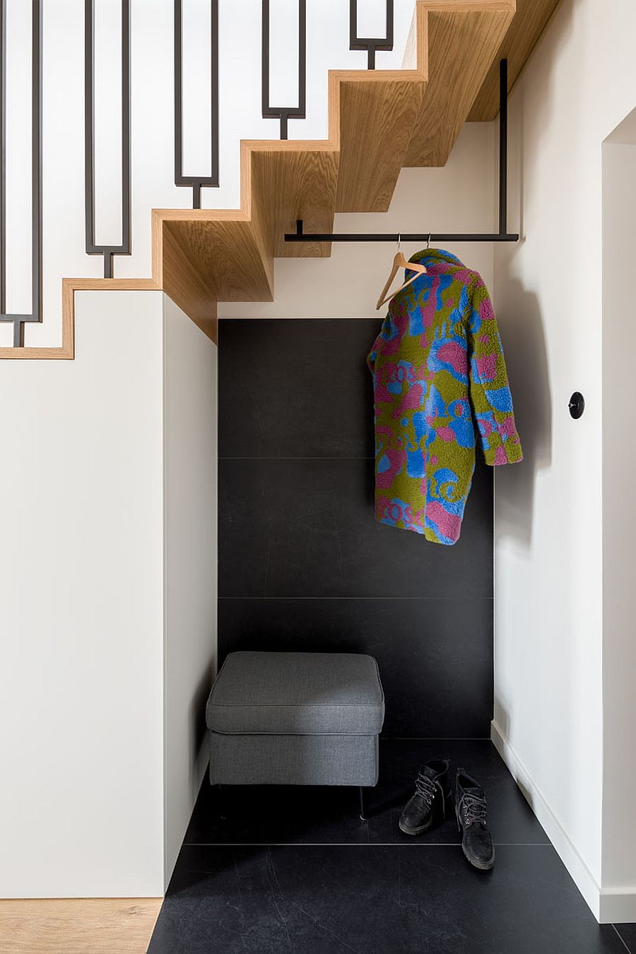 Tiny-little-niche-in-the-entryway-to-hang-coats-and-to-keep-boots