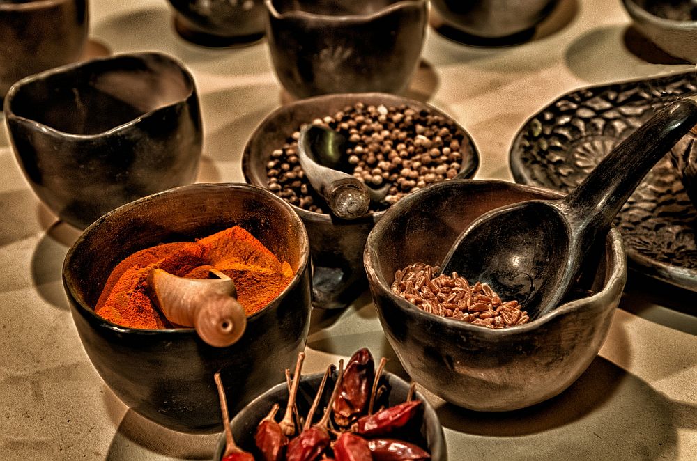 ceramic bowls filled with various spices