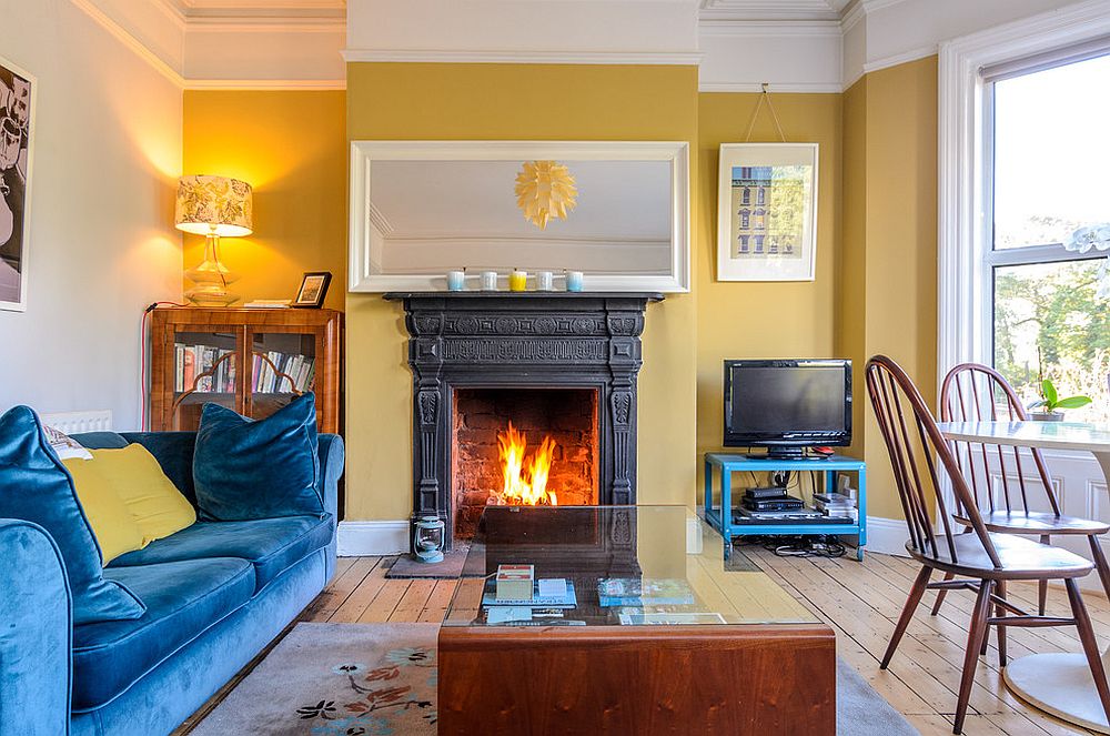 Velvet-blue-sofa-for-the-living-room-in-white-and-yellow