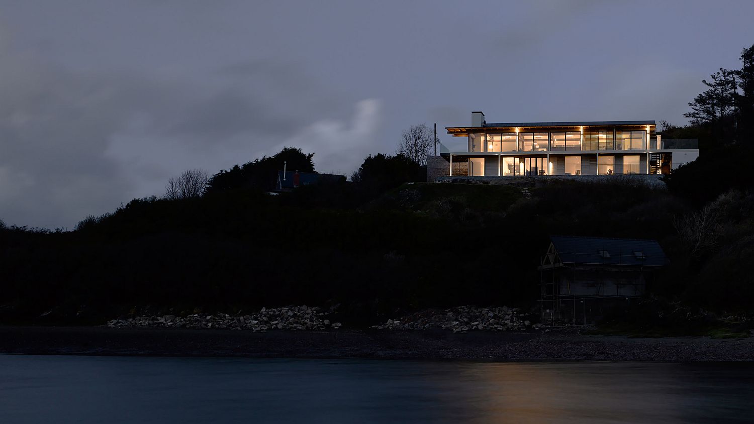 View of the Trewarren House after sunset