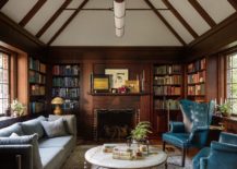 Wall-of-books-in-the-backdrop-adds-color-to-the-living-room-setting-217x155