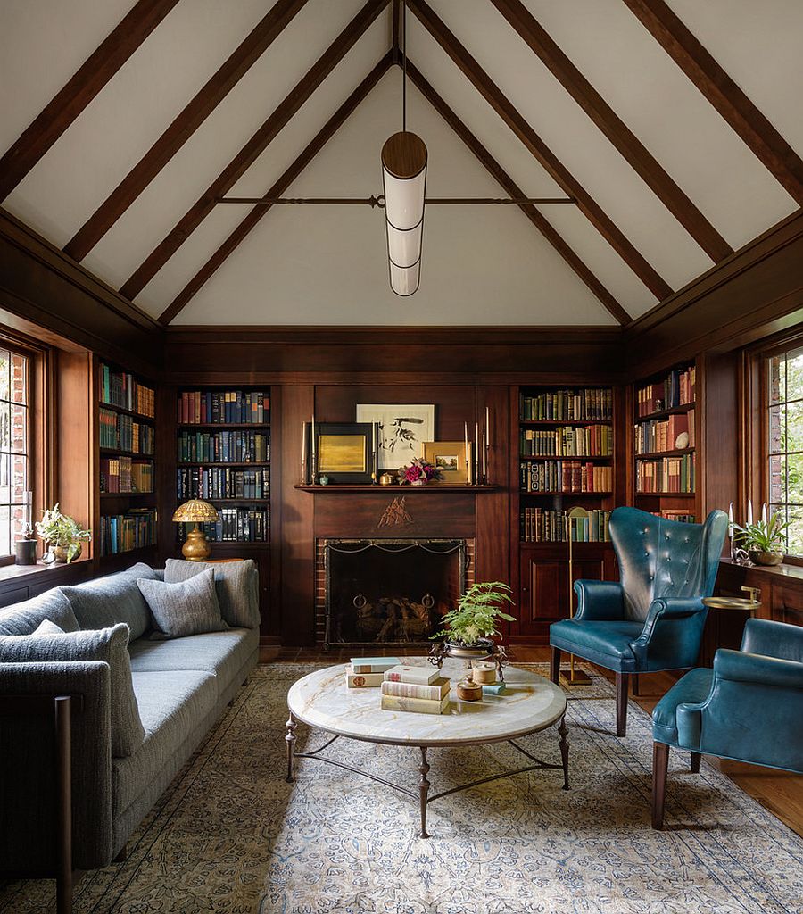 Wall of books in the backdrop adds color to the living room setting