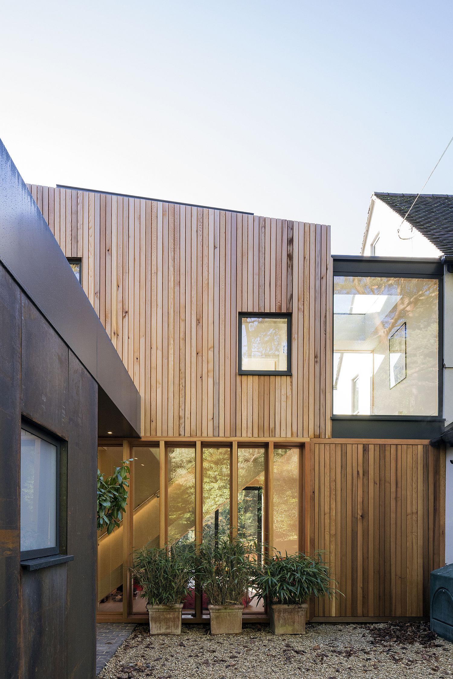 Wood-and-glass-guest-house-extension-of-British-home