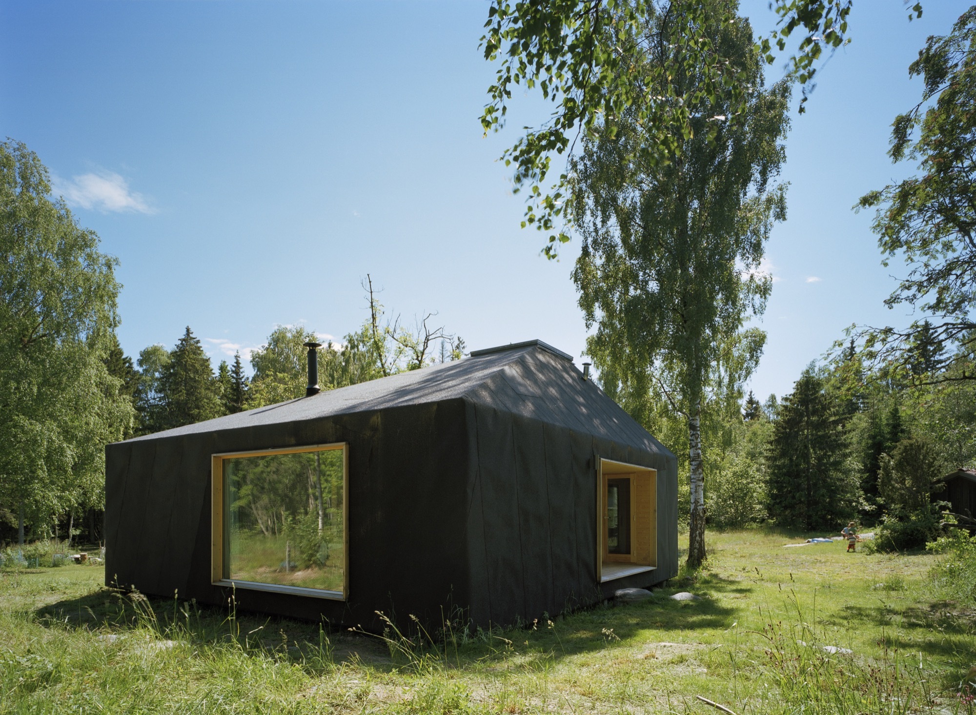 Wooden-cut-outs-and-glass-windows-create-a-seamless-indoor-outdoor-interplay