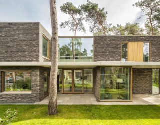 Warm Bricks, Timber Frames and Glass Brilliance Intertwined at This Dutch Villa