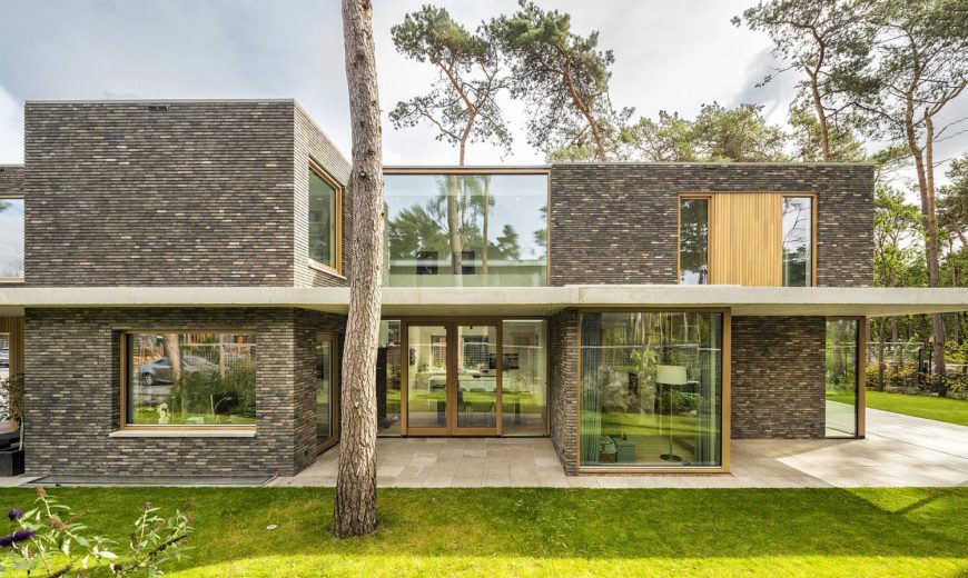 Warm Bricks, Timber Frames and Glass Brilliance Intertwined at This Dutch Villa