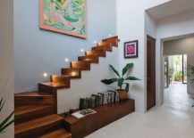 Beautifully-illuminated-wooden-staircase-with-storage-options-beneath-217x155