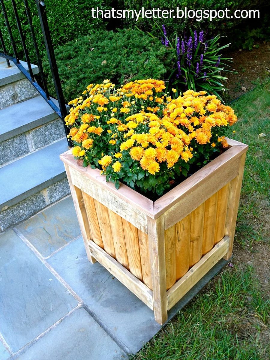 Box-style DIY planter with flowers can be placed on the yard