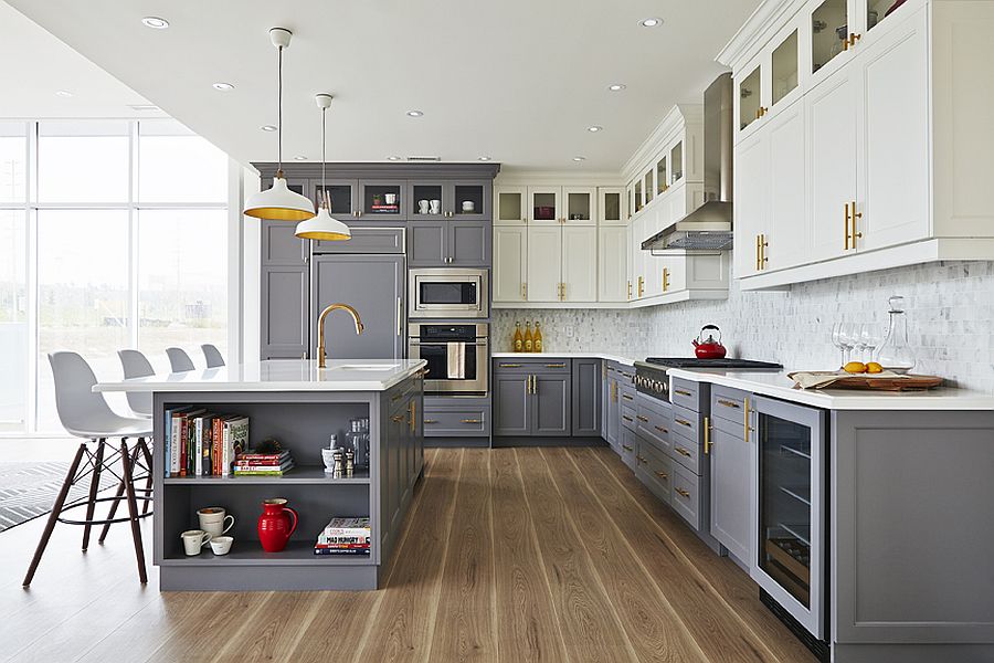 Brass-fxtures-add-metallic-glint-to-the-small-gray-and-white-kitchen