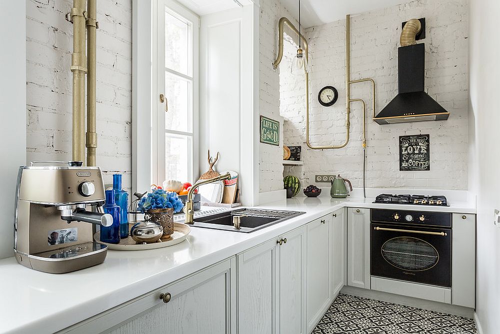 Brick painted in white brings timeless charm to the small industrial kitchen with black thrown into the mix