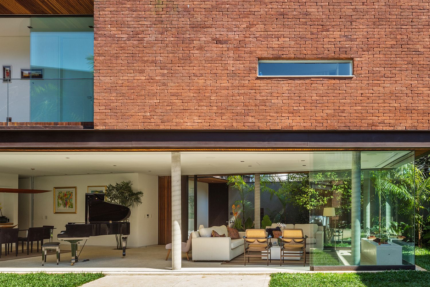 Brick wall adds unexpected textural contrast to the facade