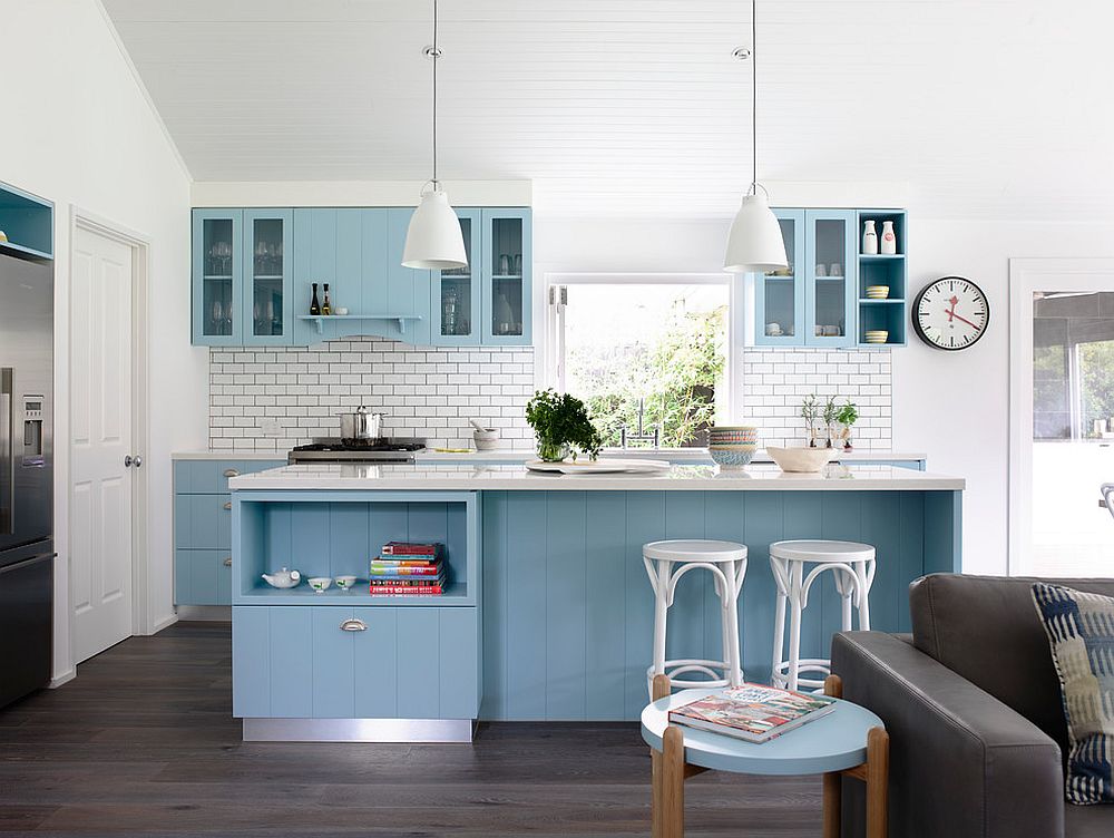 Cabinets-and-island-bring-a-gentle-shade-of-blue-to-the-white-kitchen