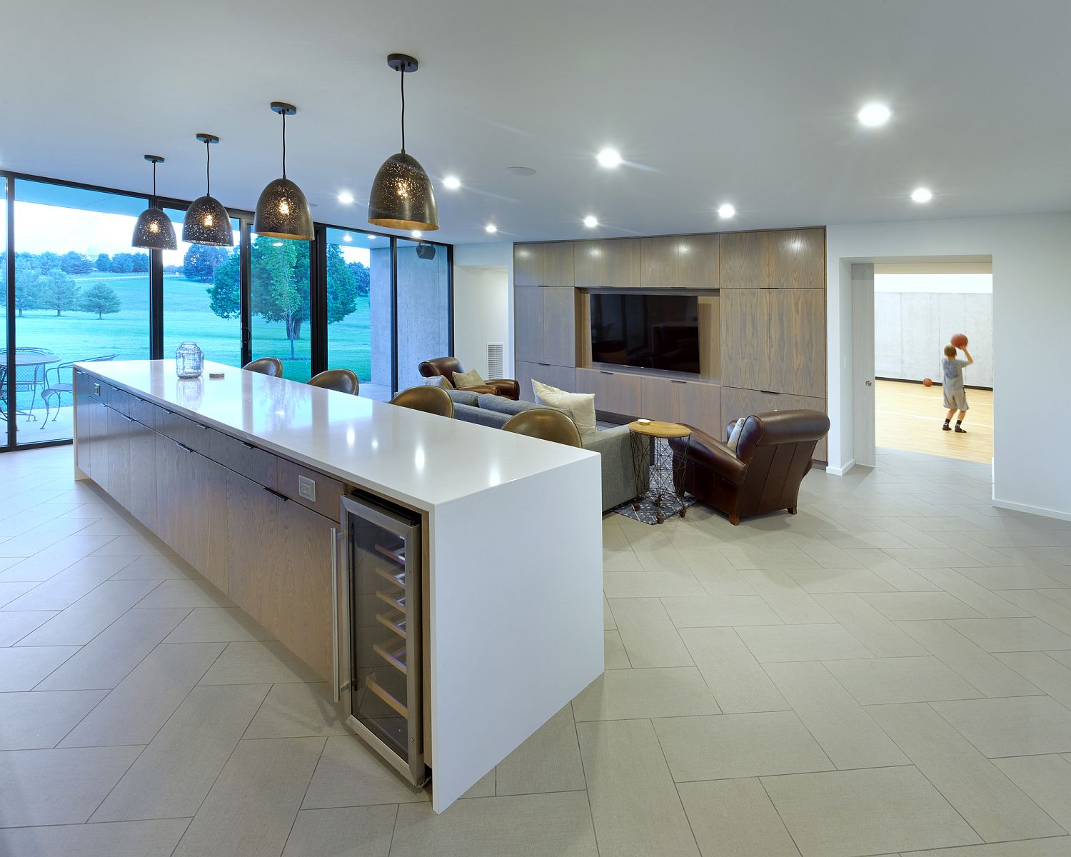 Contemporary kitchen on the suburban home in white with a spacious island