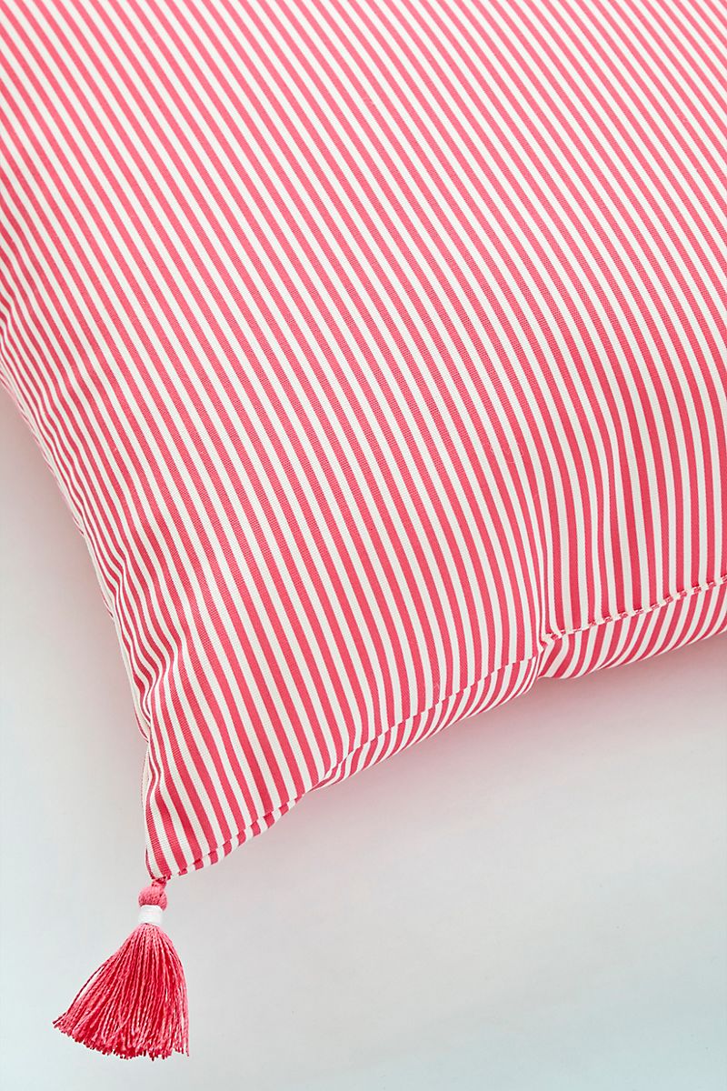 Coral-striped-throw-pillow-with-tassels