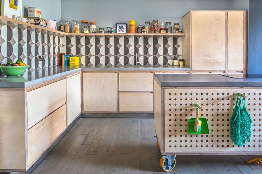 Custom kitchen island on wheels with pegboard offers multiple storage options