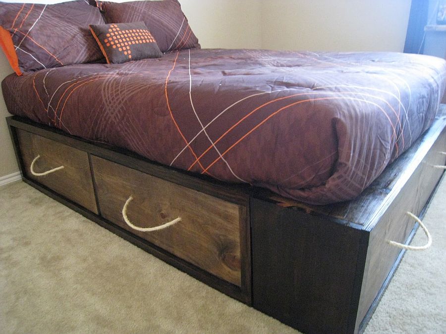 DIY wooden crates crafted from reclaimed wood adds storage space to bed