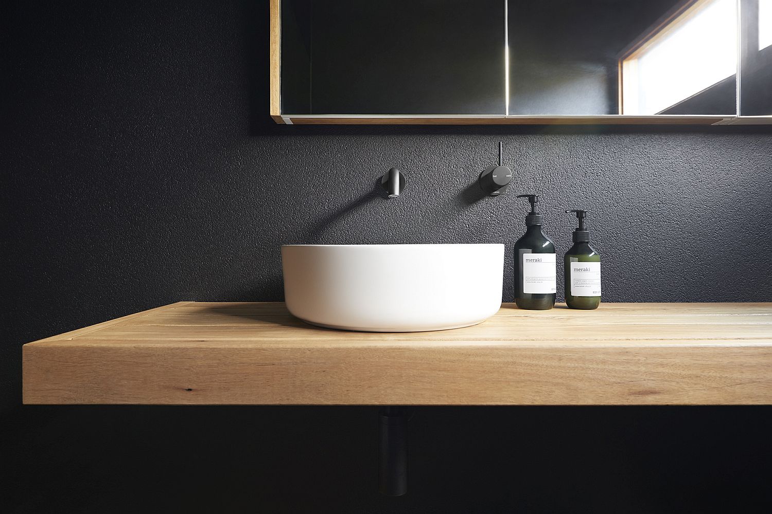 Dashing minimal barhroom in black with a floating wooden vanity