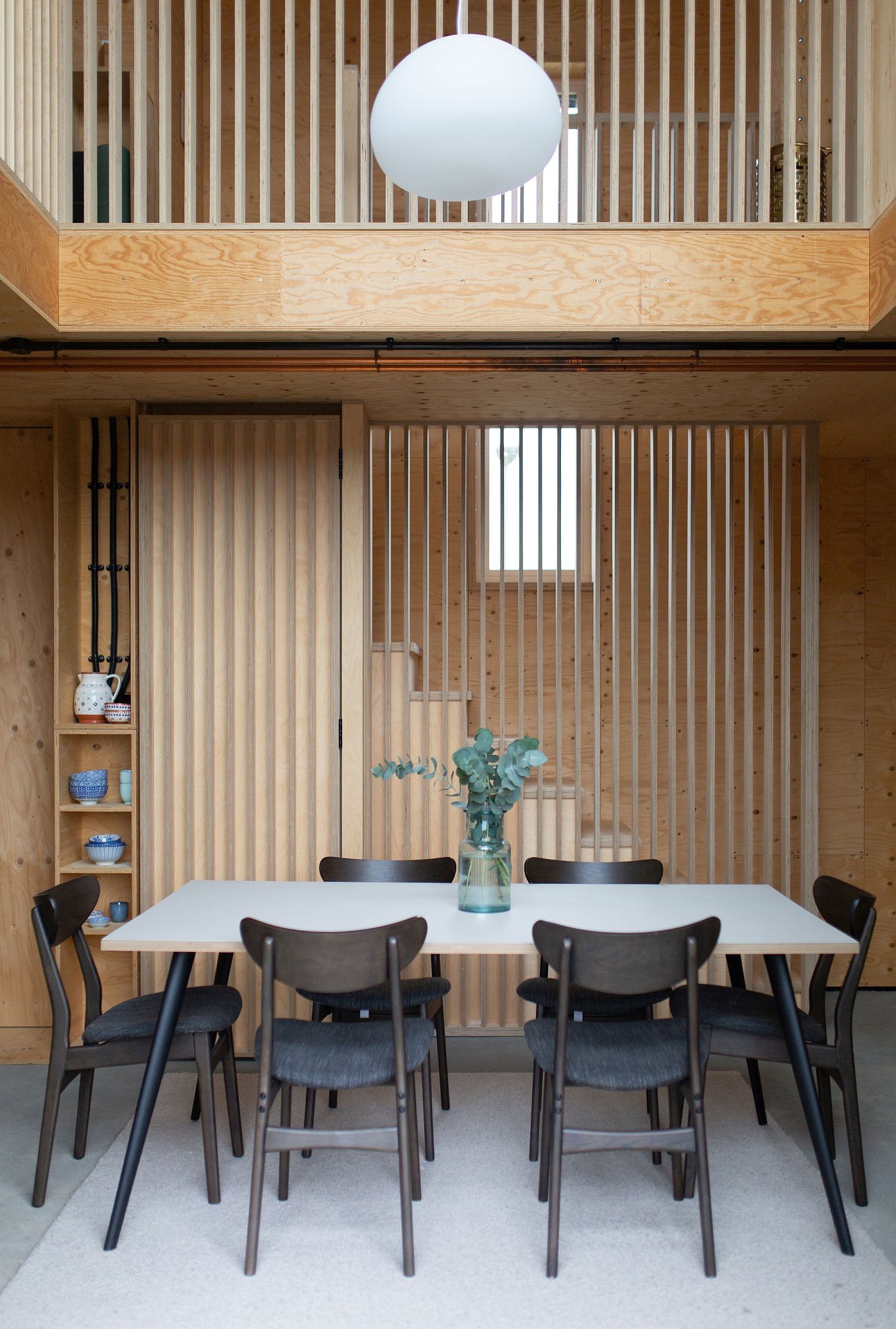 Double-height dining area of the Box House