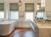 Fabulous-eclectic-bathroom-with-wooden-floor-and-white-bathtub-217x155