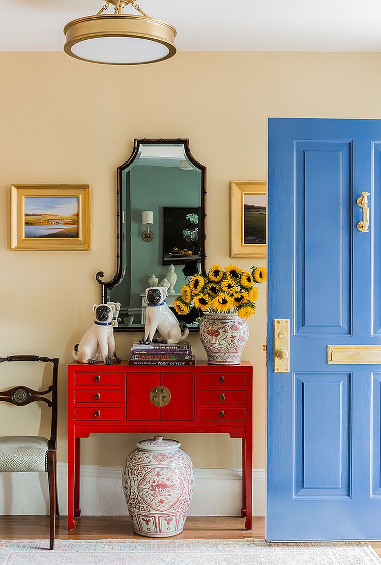Gorgeous-blue-door-with-brass-fittings-and-an-entry-room-in-light-yellow