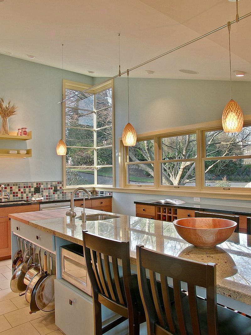 Hanging the pots and pans at the side of the kitchen island to save space