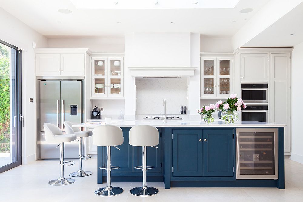 Island-adds-a-bold-splash-of-navy-blue-to-the-brightly-lit-white-kitchen