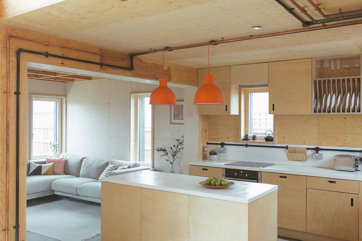 Light-filled and bright kitchen design in white and wood