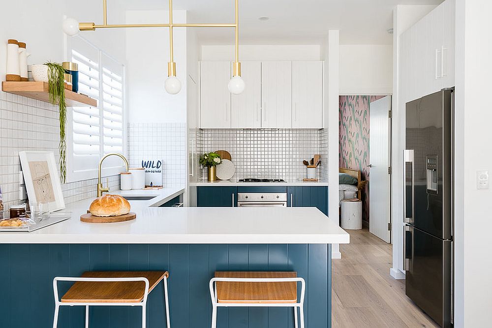 https://cdn.decoist.com/wp-content/uploads/2019/07/Lighting-fixture-adds-metallic-charm-to-the-small-kitchen-in-blue-and-white.jpg