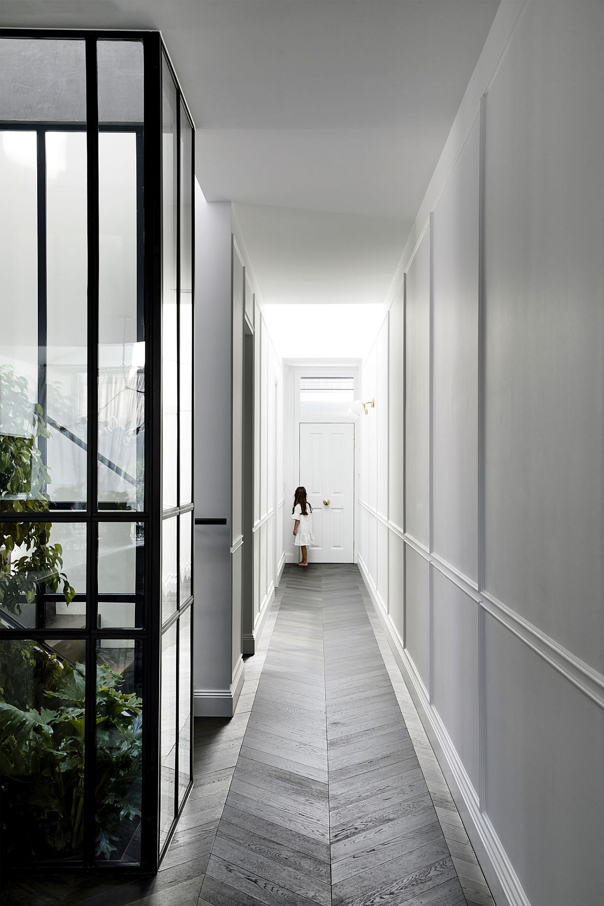 Long corridor and atrium welcome you at this Melbourne house