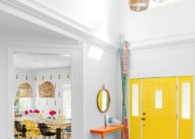 Look-at-the-contemporary-entry-room-of-New-York-home-with-bright-yellow-door-217x155