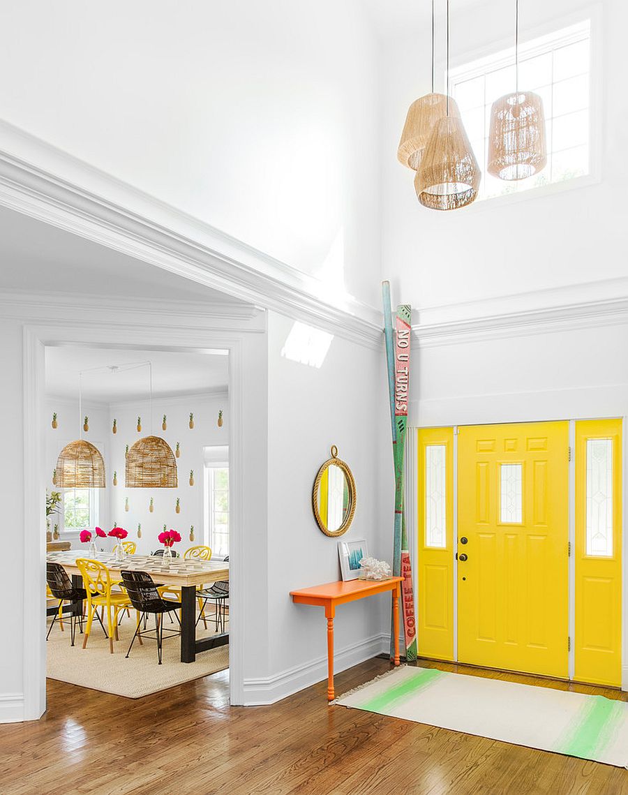 Look-at-the-contemporary-entry-room-of-New-York-home-with-bright-yellow-door