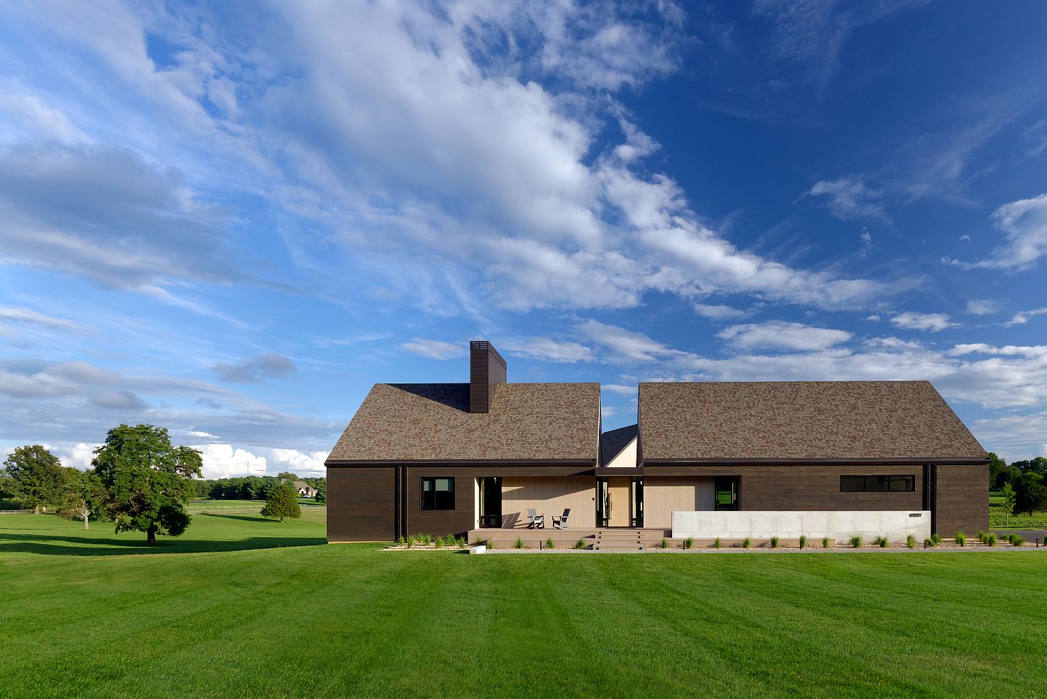 Modern classic house in Rogersville clad in different types of cedar