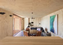 Open-living-area-of-the-Aussie-home-with-plywood-walls-217x155