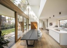 Open-plan-kitchen-and-dining-with-a-skylight-above-that-brings-in-ample-ventilation-217x155