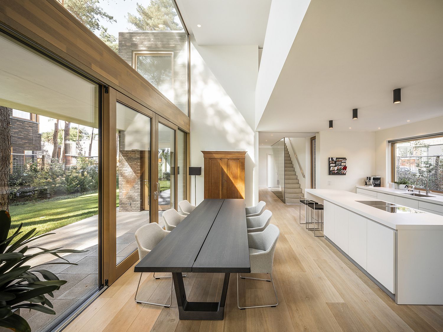 Open plan kitchen and dining with a skylight above that brings in ample ventilation